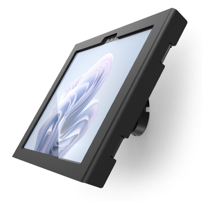 Vue latérale du support mural noir Compulocks Bow Apex pour Microsoft Surface Pro 11, monté sur un mur.